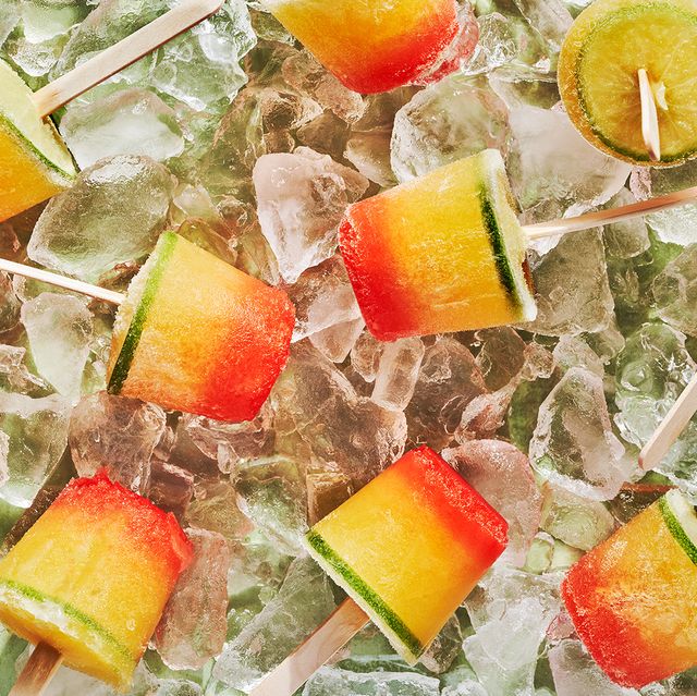 ombre tequila sunrise dixie cup pops topped with a lime