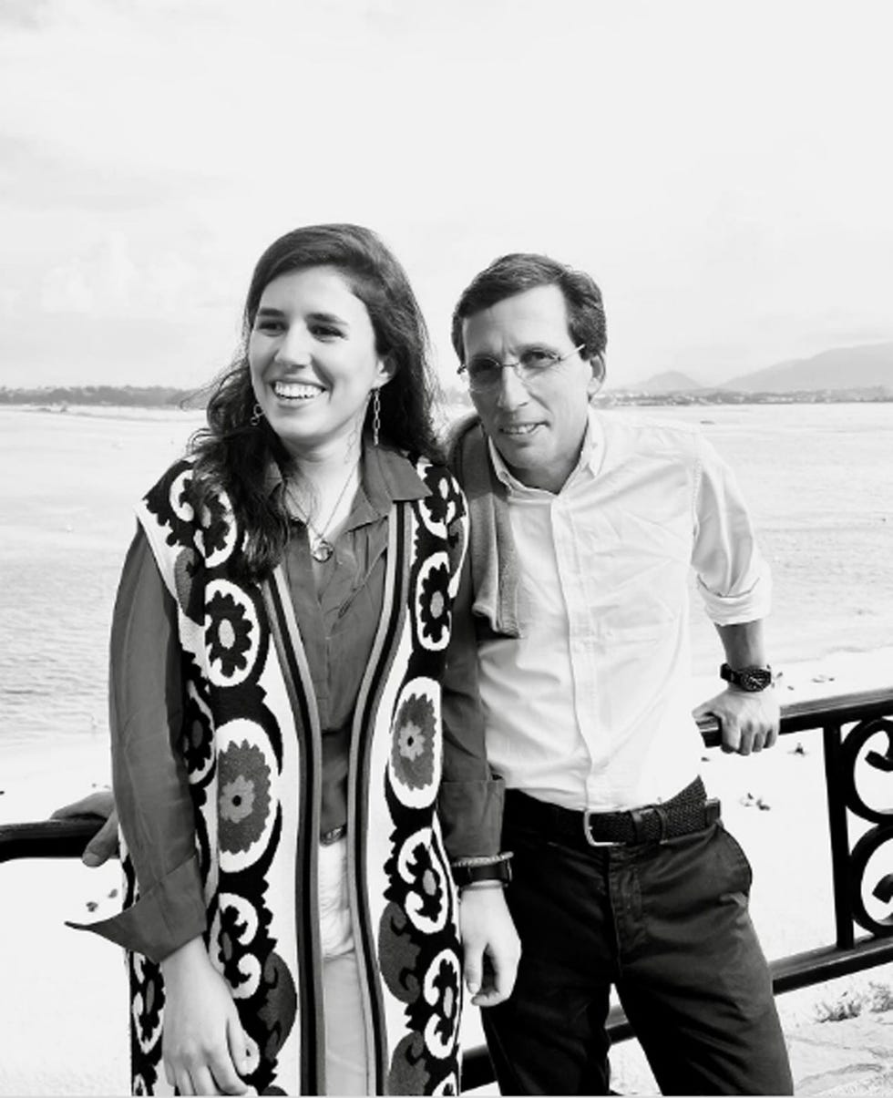 a man and woman posing for a picture on a boat