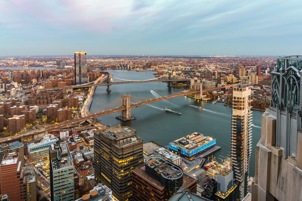 a bridge over a river in a city
