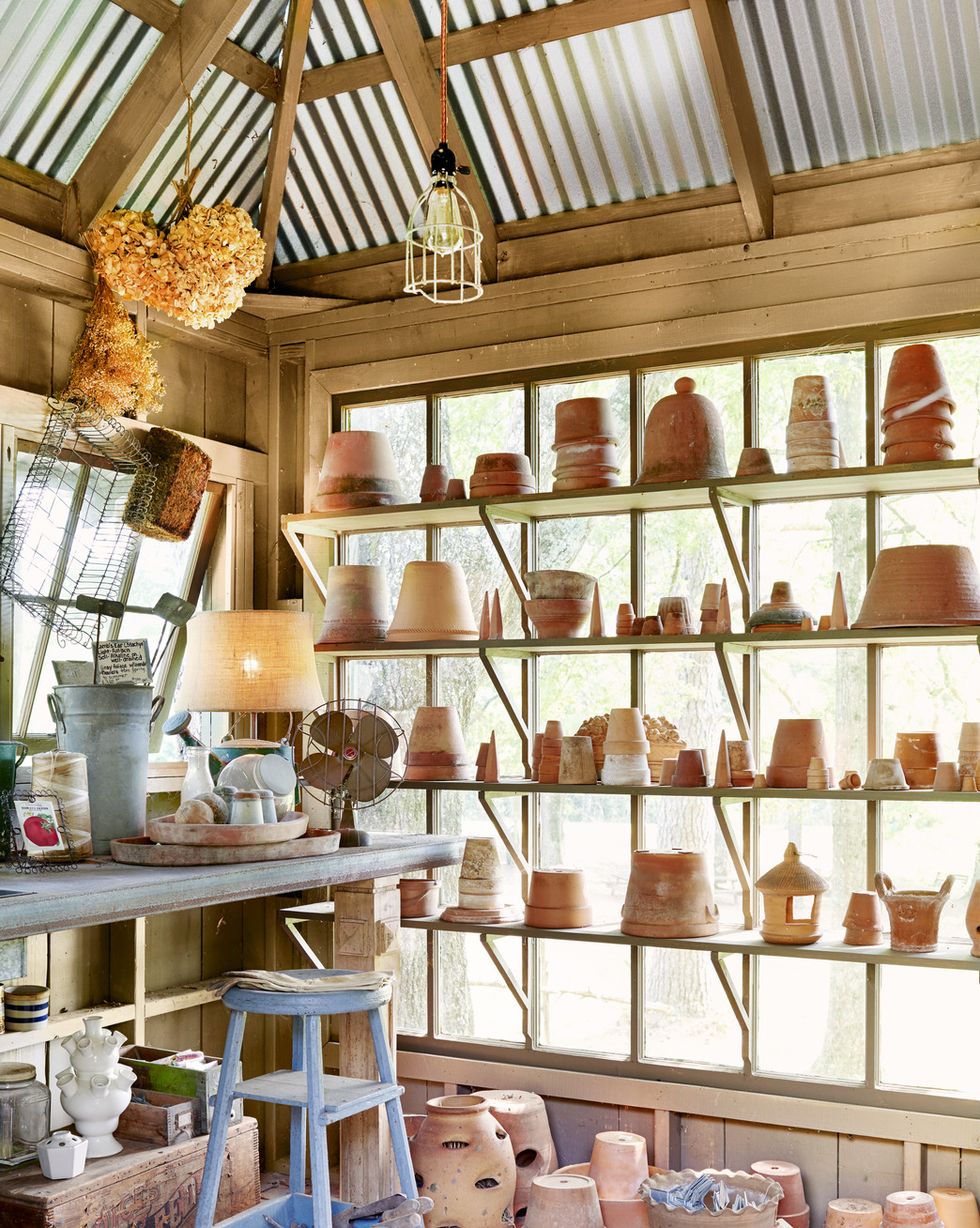 potting shed with piles of terra cotta pots