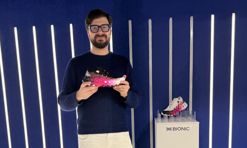showcase of a sneaker design with a person holding one shoe