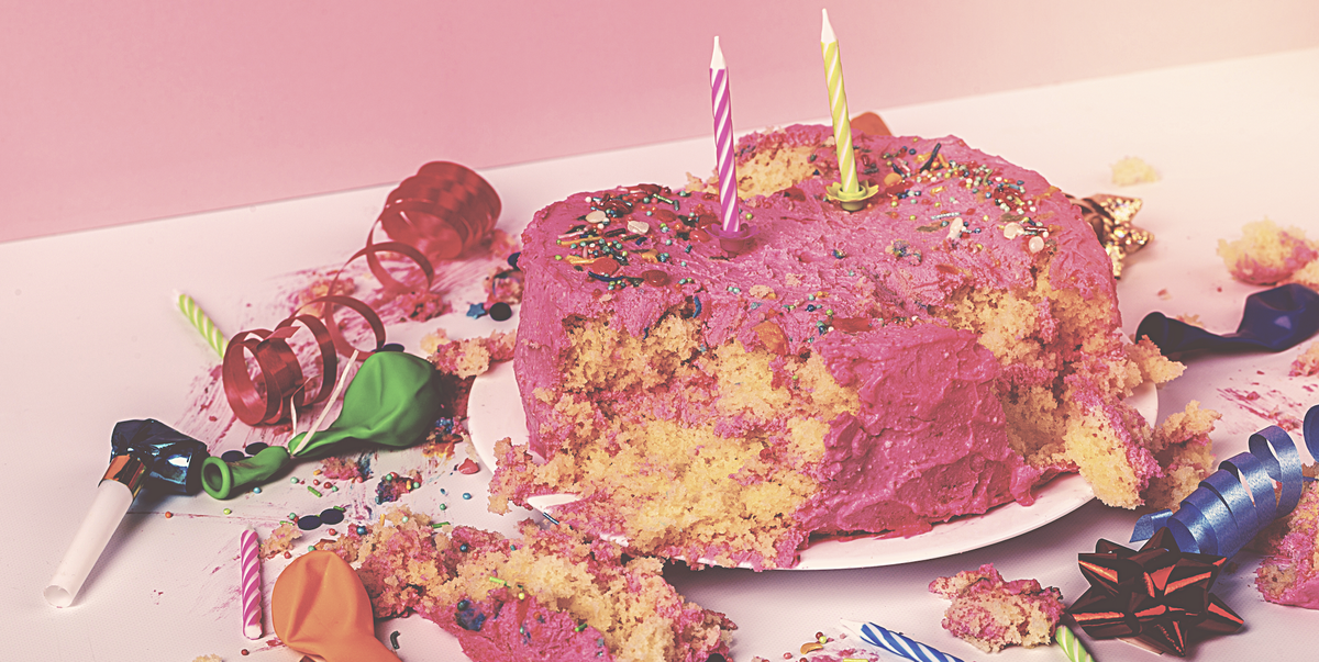 ruined birthday cake with party debris