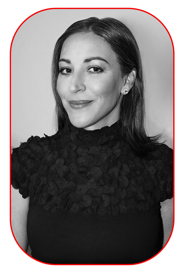 a womans upper body is dressed in a black shirt with textured embellishments on the shoulders a womans upper body is dressed in a black shirt with textured embellishments on the shoulders