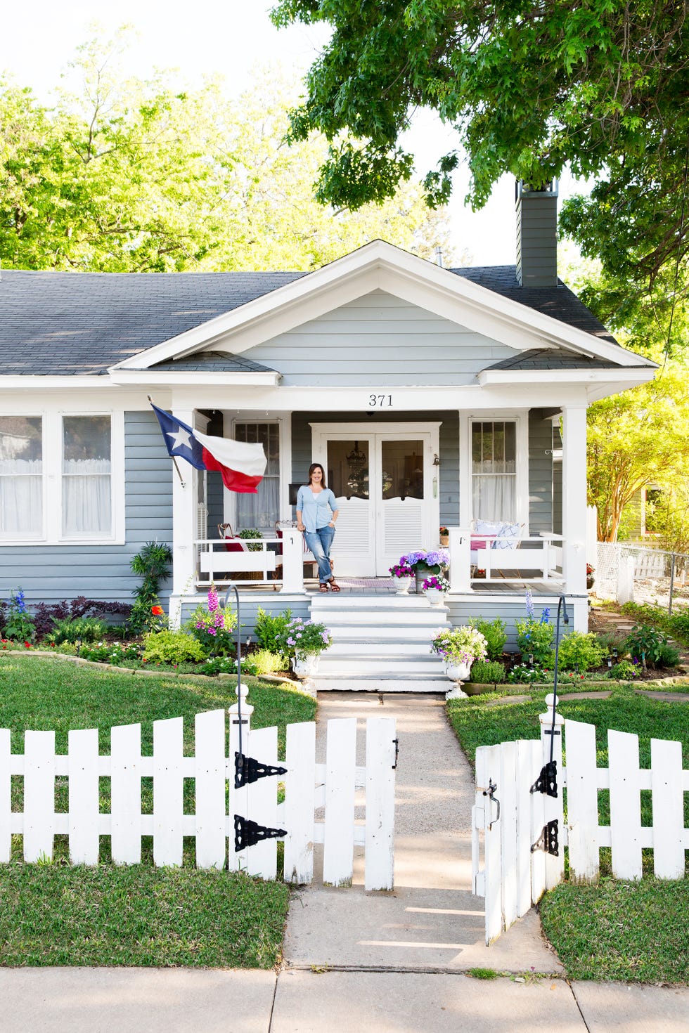 blue craftsman cottage with white trim