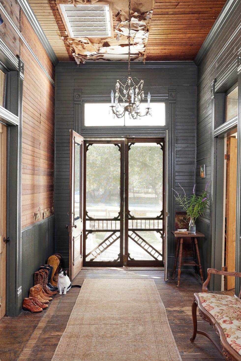 texas hill country farmhouse entry that is rustic and has original screen doors