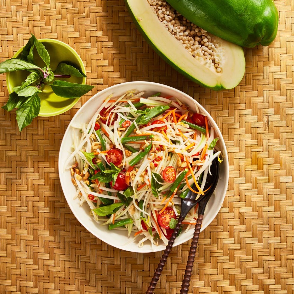 thai green papaya salad in a white bowl