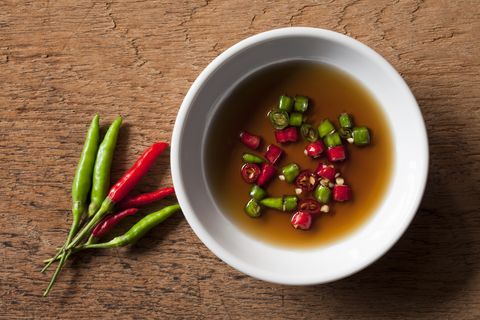 thai red and green chili in bowl of fish sauce