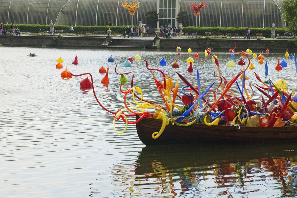 Thames Skiff by Dale Chihuly in front of the Palm House Royal Botanic Gardens, Kew, Surrey, England, United Kingdom