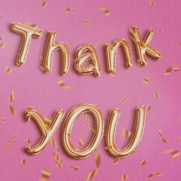 thank you in golden foil ballon.pink background