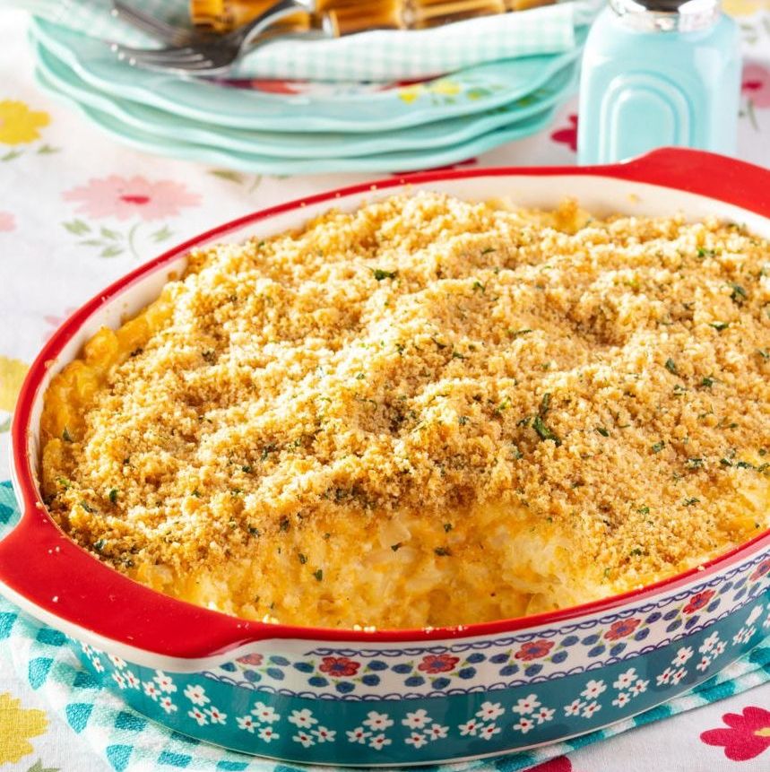 cheesy potato casserole in floral baking dish