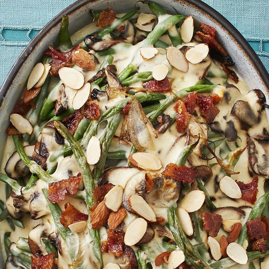 green bean mushroom casserole with candied bacon and almond slices close up