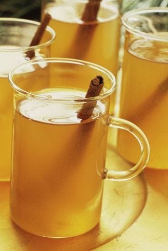 mulled cider with a cinnamon stick