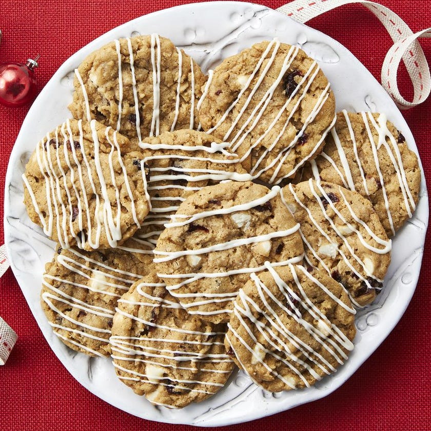 oatmeal slice and bake cookies with white chocolate drizzle on red background