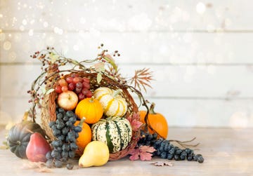 thanksgiving cornucopia on a white wood background