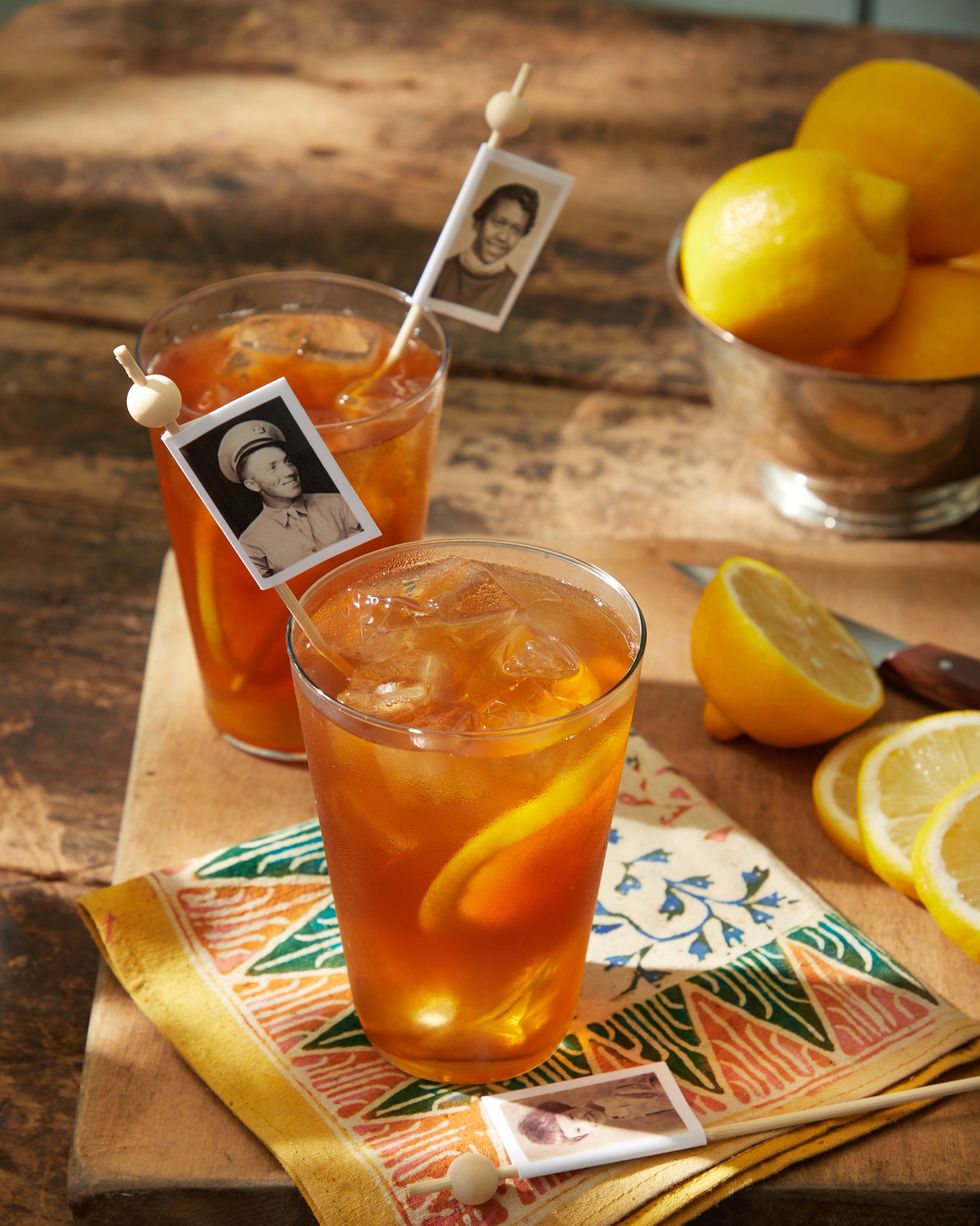 copies of vintage photos wrapped around drink picks resting in glasses ice tea