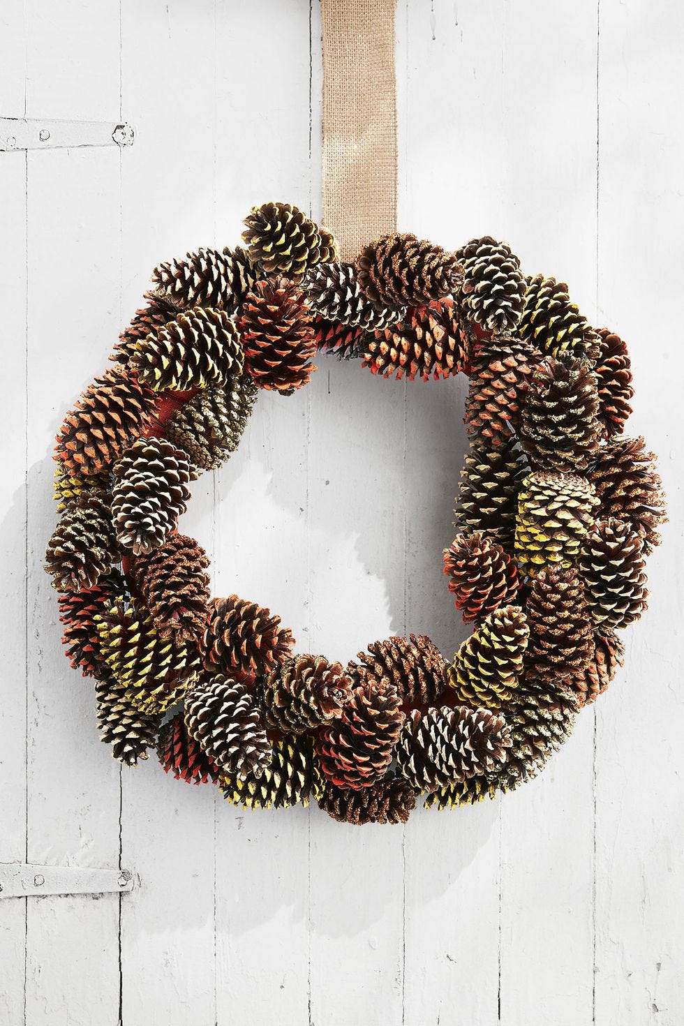 painted pine cone wreath