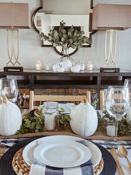 thanksgiving decorations, thanksgiving table setting with pumpkins and greenery