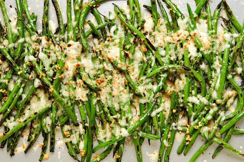 roasted green beans with melted parmesan on top