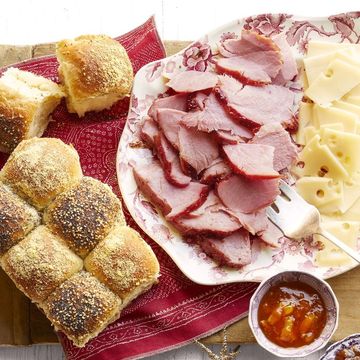 ham slices on plate with cheese and checkerboard rolls