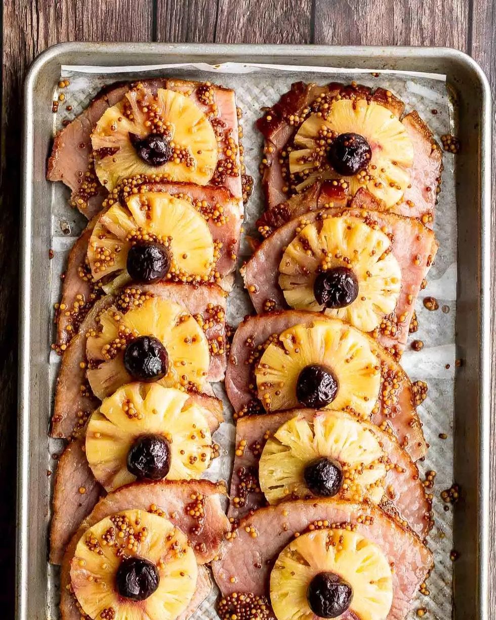 pineapple glazed ham slices on sheet pan