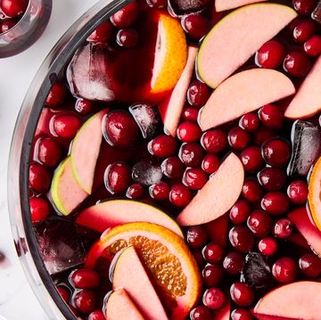 jungle juice with cranberries, apples, and oranges