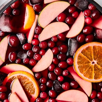 jungle juice with cranberries, apples, and oranges