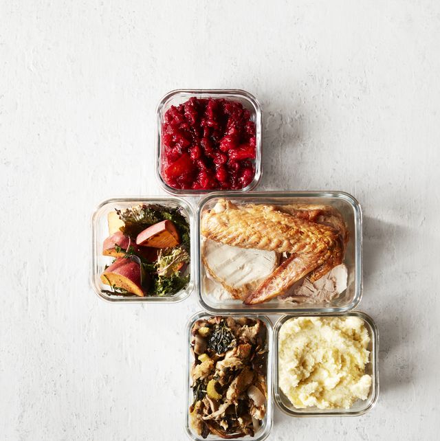 thanksgiving leftovers in containers on white wood