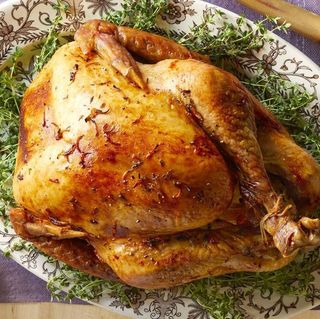 thanksgiving menu turkey with herbs on platter