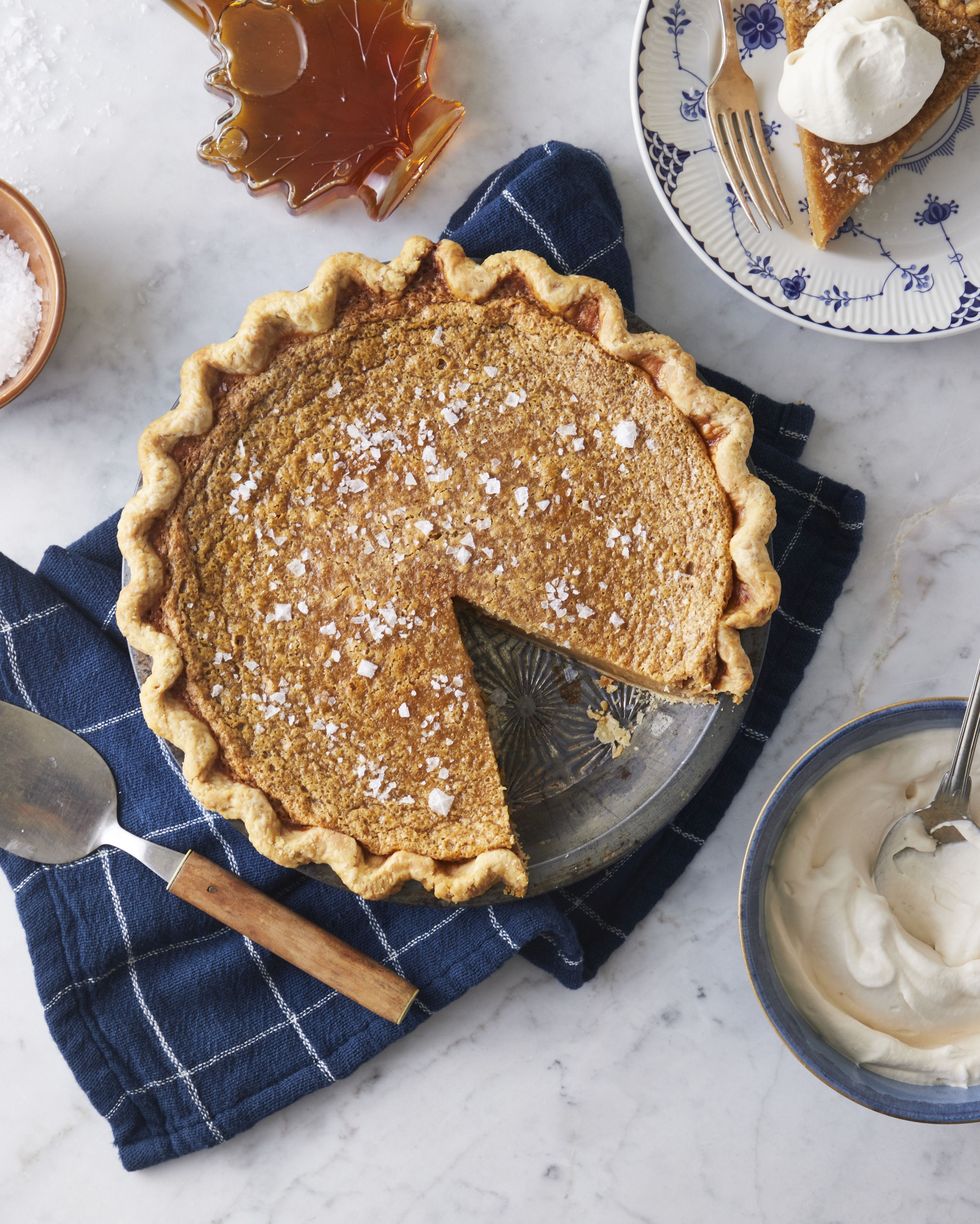 salted maple syrup pie with a slice removed on a plate to the side