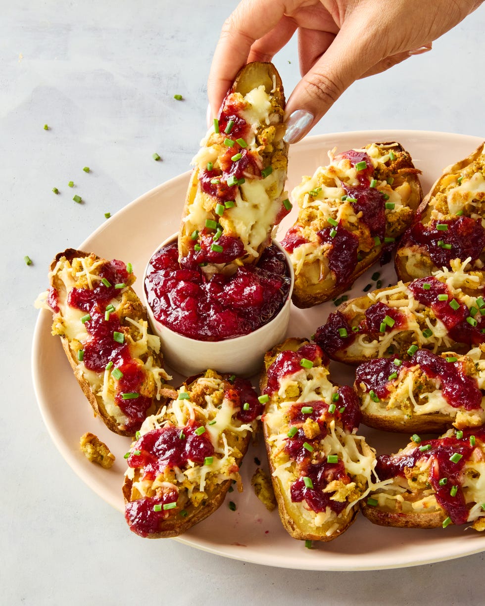 potato skins stuffed with mashed potatoes, stuffing, turkey, and topped with cranberry sauce