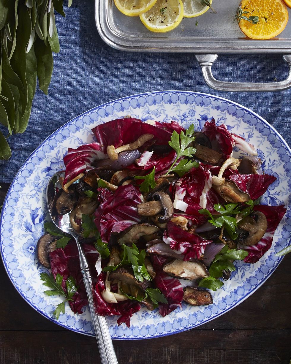 roasted mushrooms and radicchio on a platter garnished with parsley