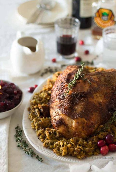 slow cooker cajun turkey with maple glaze and cranberries on side