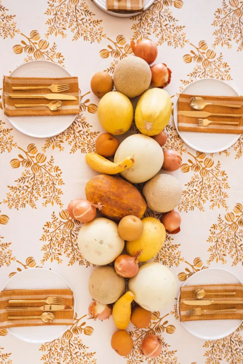 thanksgiving table setting golden fruit vegetable centerpiece