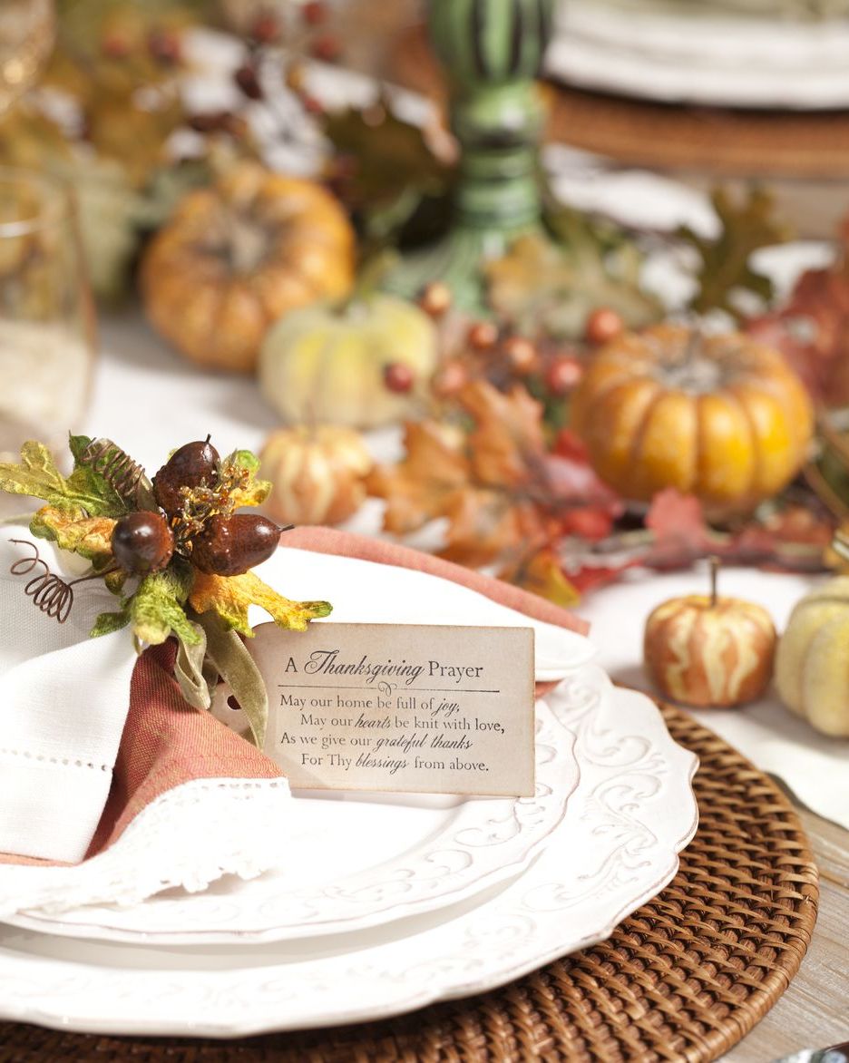 a fancy table setting with a tag that has the thanksgiving prayer printed on it