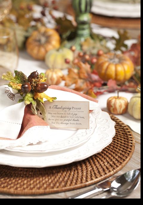 a fancy table setting with a tag that has the thanksgiving prayer printed on it
