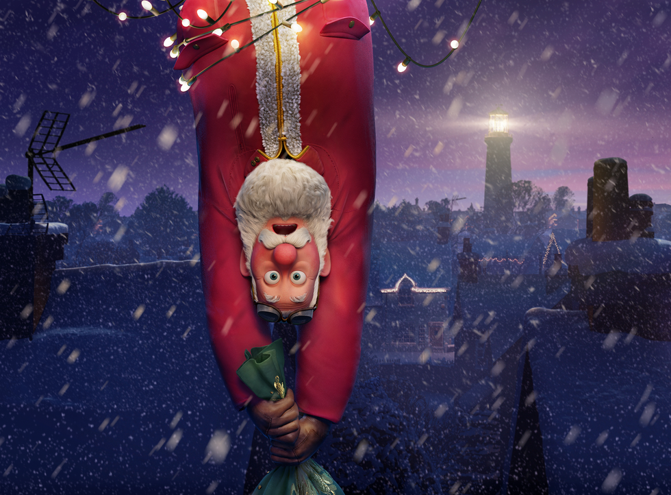 a character in a red outfit holding a green bag surrounded by snowy scenery and decorative lights