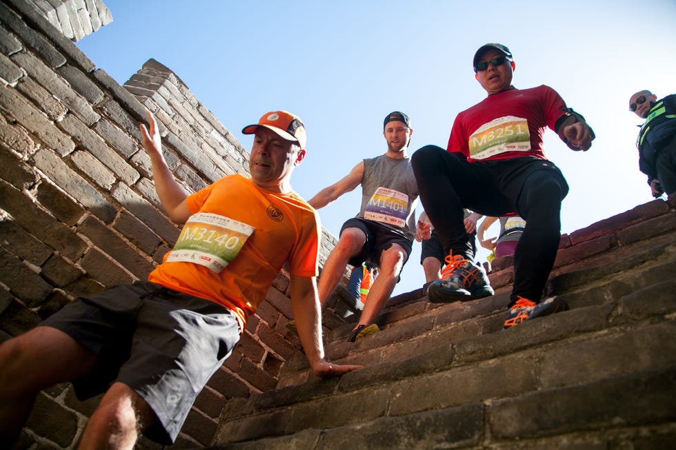 runners descend stone steps