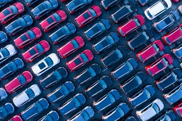 The aerial photograph of the outdoor warehouse of the new car.