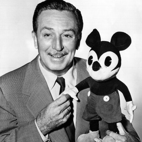 walt disney with a mickey mouse puppet