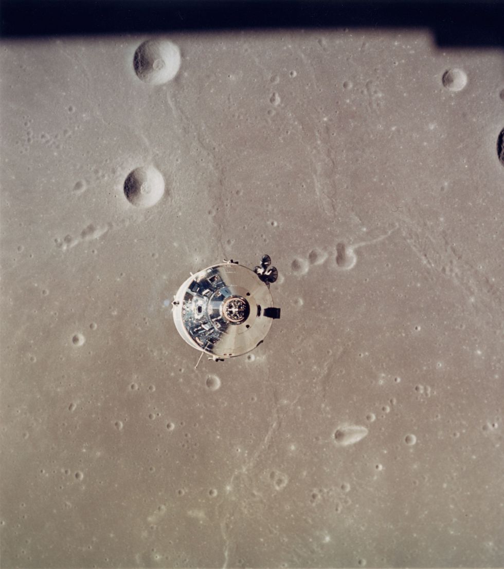 The Apollo 11 Command and Service Modules are photographed from the Lunar Module in lunar orbit during the Apollo 11 landing mission