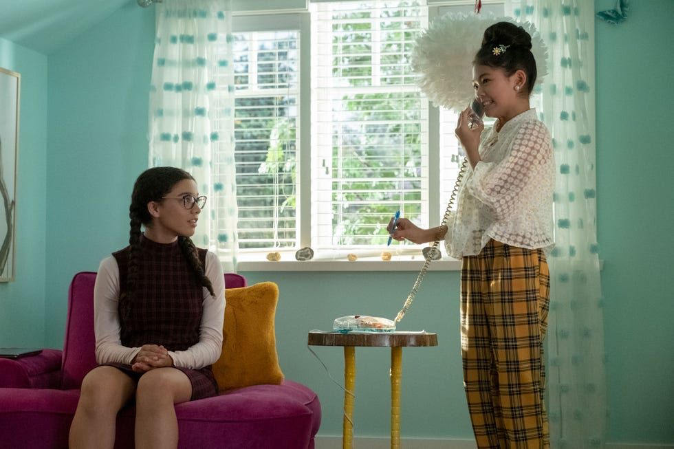 malia baker as mary anne spier and momona tamada as claudia kishi in the baby sitters club on netflix