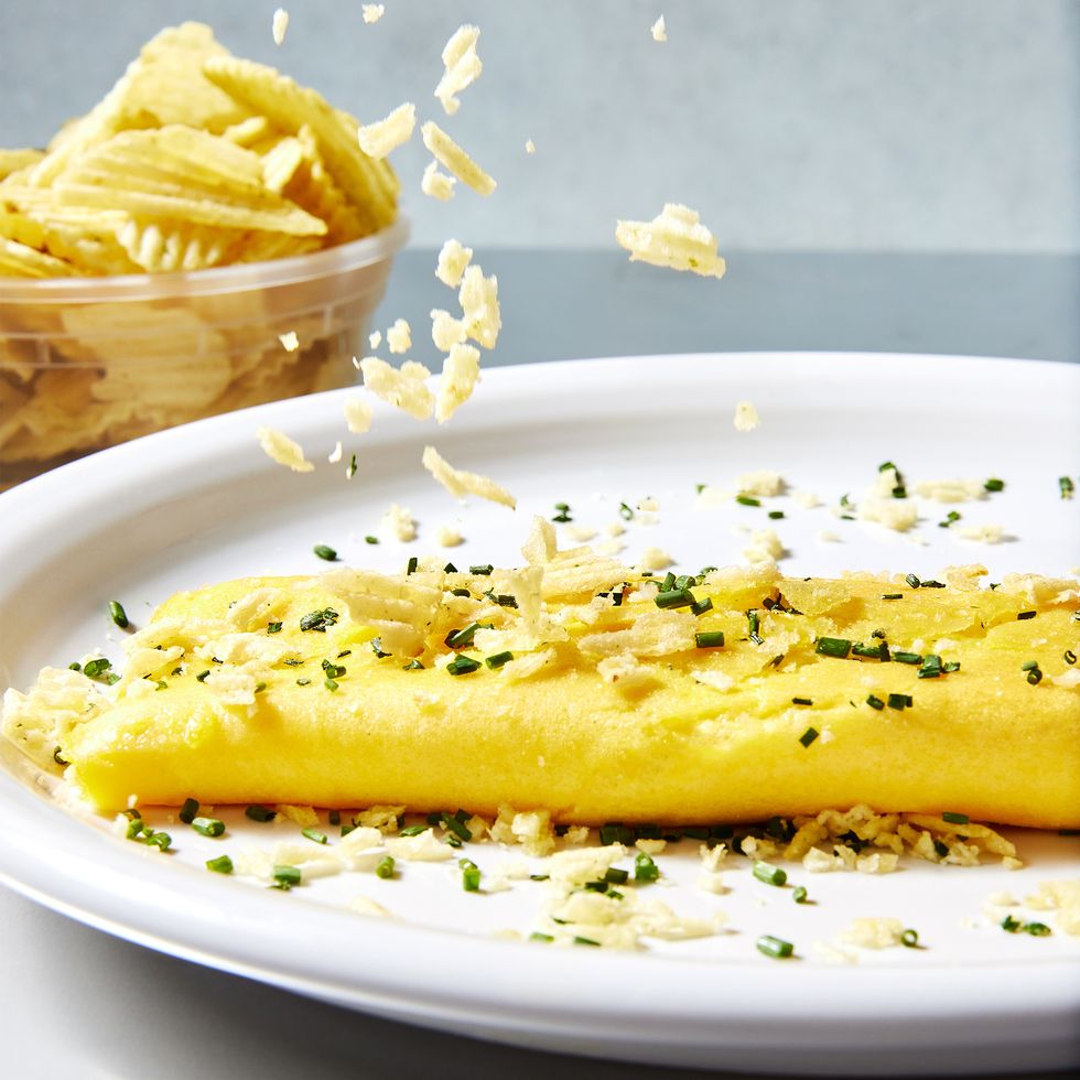 boursin omelet with sour cream onion potato chips sprinkled on top with chives
