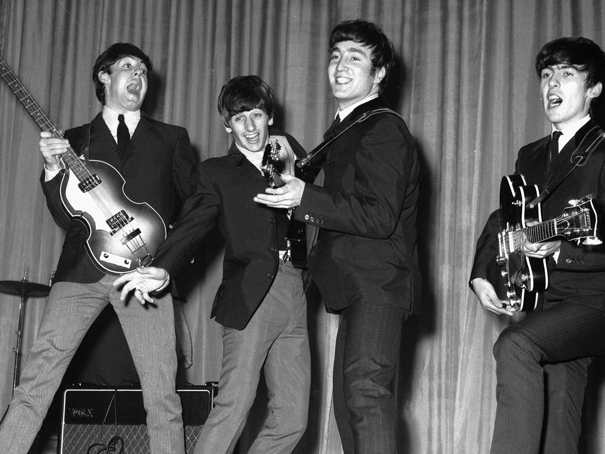 https://hips.hearstapps.com/hmg-prod/images/the-beatles-rehearse-for-that-nights-royal-variety-performance-at-the-prince-of-wales-theatre-4th-november-1963-the-queen-mother-will-attend-photo-by-central-press_hulton-archive_getty-images.jpg?crop=0.75xw:1xh;center,top&resize=1200:*