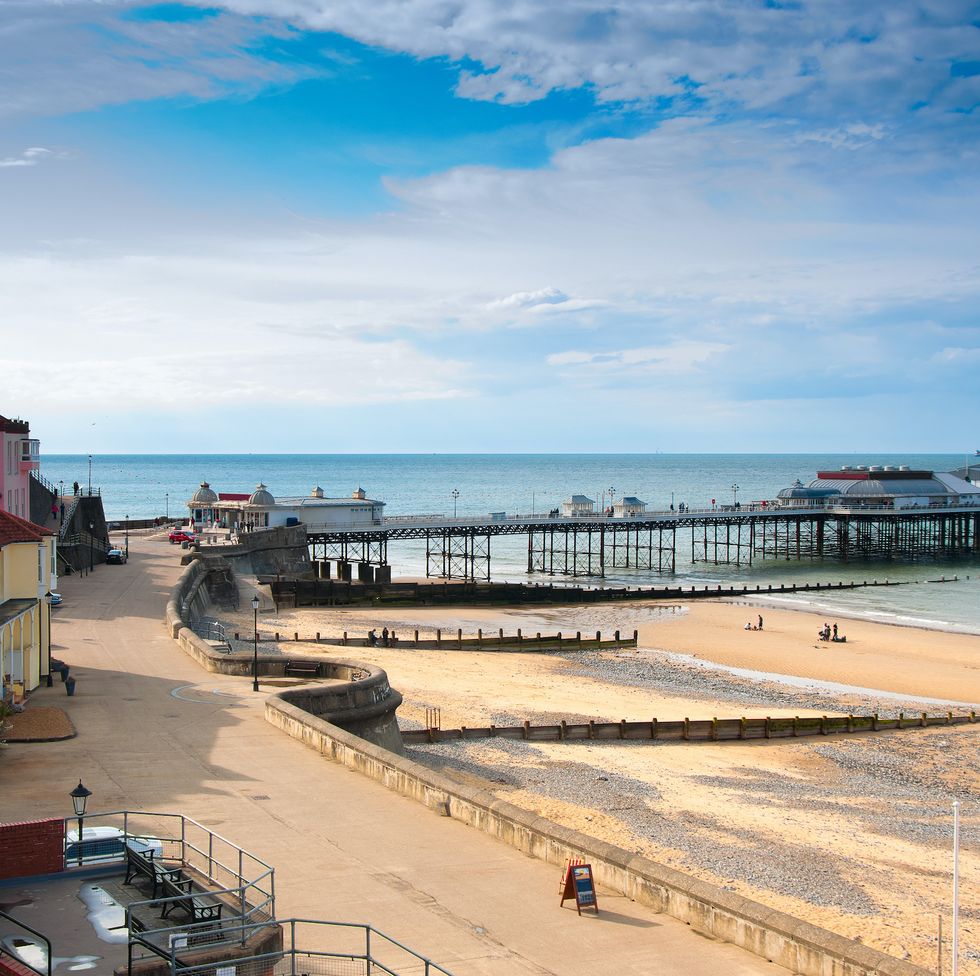 a view of promenade, town centrem, and pier, cromer, seaside town in norfolk, england
