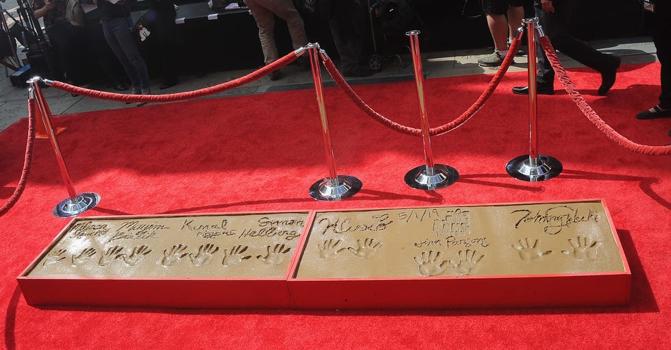 The Cast Of "The Big Bang Theory" Places Their Handprints In The Cement At The TCL Chinese Theatre IMAX Forecourt