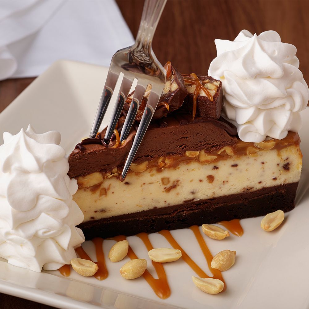 the cheesecake factory chocolate caramelicious cheesecake made with snickers