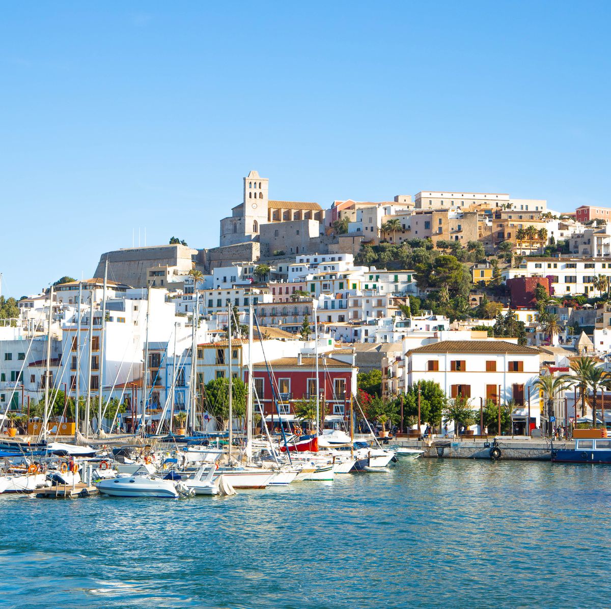 https://hips.hearstapps.com/hmg-prod/images/the-colorful-old-town-of-ibiza-with-the-royalty-free-image-1647876520.jpg?crop=0.668xw:1.00xh;0.104xw,0&resize=1200:*