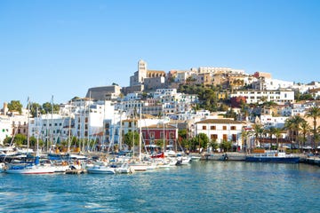 the colorful old town of ibiza with the mediterranean sea, fortification and harbor