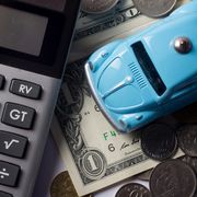 The concept of saving money for travel, buy a dream car and car repairs.