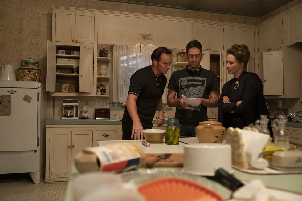 michael chaves on set of the conjuring 3 with patrick wilson and vera farmiga